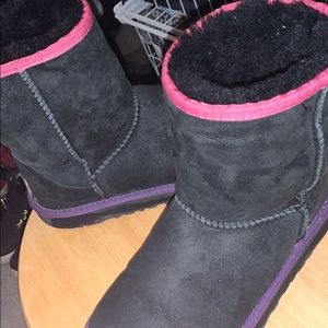 little girls pink, purple, and black uggs